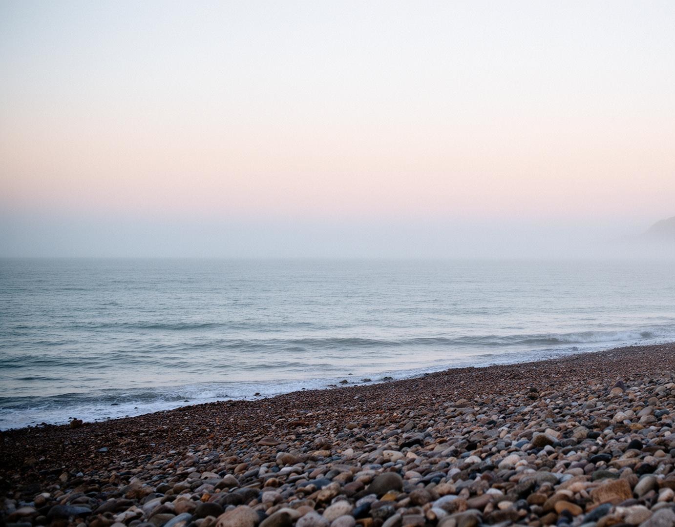 Calm sea and shingle beach on the Kent coast
